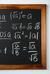 Wall Mural - Blackboard with different mathematical formulas written with chalk on white wall
