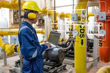 Wall Mural - Maintenance technician at a heating plant,Petrochemical workers supervise the operation of gas and oil pipelines in the factory,Engineers put hearing protector At room with many pipes