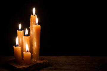 Six burning candles against a black background. International Holocaust Remembrance Day, January 27.