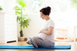 © famveldman - Pregnancy yoga. Exercise for pregnant woman.