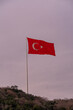 National Flag of Turkey flying on the top of a hill
