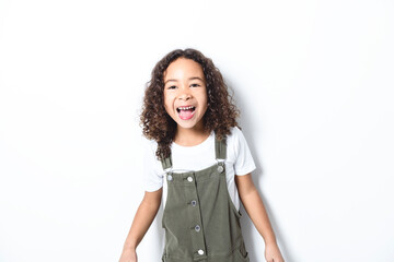 Wall Mural - Adorable black little girl with beautiful curly hairstyle isolated over white