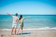 © travnikovstudio - Young couple on white beach during summer vacation.