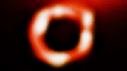 Poster - Close up of an abstract fluctuating blurred ring on a dark background. Motion. Spinning energy circle.