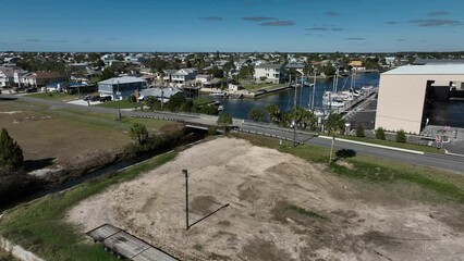 Fototapete - Rising up above Hernando Beach Florida overlooking beautiful homes on the ocean canals