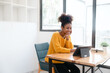 © NanSan - Pretty young african american student woman study online class in tablet video call zoom teacher learning english language experiment in knowledge-gathering from any location of their choice.