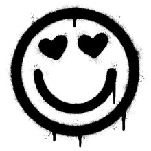 Spray Painted Graffiti Hearts Eyes Emoticon Sprayed Isolated With A White Background. Graffiti Smile In Love Emoticon Icon With Over Spray In Black Over White.