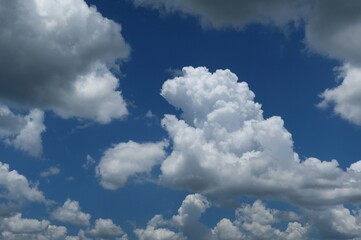 Wall Mural - Beautiful view on blue sky with shaped clouds