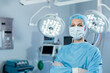 © Wavebreak Media - Portrait of caucasian female surgeon in an operating theatre, wearing face mask