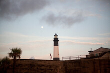 A Full Moon Sets Over Tybee Island Lighthouse Near Savannah, GA