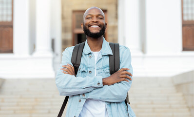 Poster - Portrait, education and proud man, university and student at campus for learning, future and goals. Face, learner and college, scholarship and young guy smile, study and knowledge, academic and goals
