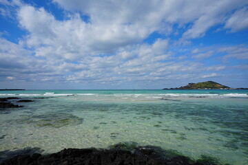 Wall Mural - crystal clear beach and distant island