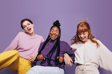 Group Of Three Young, Multiethnic Friends Having A Blast Together In A Studio. They Are Dancing And Laughing, Excited And Having Fun. In A Lively Scene Full Of Energy, The Girls Show Their Friendship.