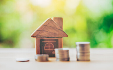 Wall Mural - Coins placed on the wood is ladder and House placed on the wood. planning savings money of coins to buy a home concept, concept property mortgage and investment or saving for a buy house.