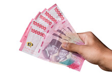 Hand Holding IDR 100,000 Rupiah Note Isolated On White Background.