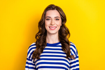 Sticker - Photo of adorable sweet girl dressed striped pullover smiling showing white teeth isolated yellow color background