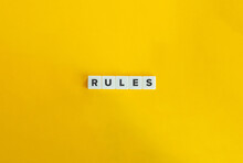 Rules Word On Block Letter Tiles On Yellow Background. Minimal Aesthetics.