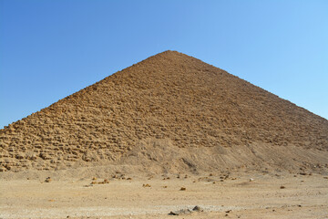 The red north pyramid of Dahshur of king Sneferu, named for the rusty reddish hue of its red limestone stones, also called the bat pyramid, it contains burial chambers, vintage retro ancient Egypt