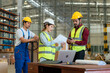 © 2B - Group of warehouse workers having a meeting