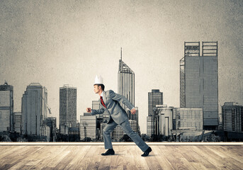 Wall Mural - King businessman in elegant suit running and drawn cityscape silhouette at background