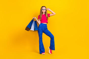 Canvas Print - Full length photo of positive lady trendy outfit advertising low prices quality clothes empty space isolated on yellow color background