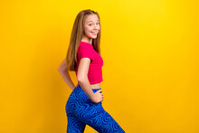 Photo Of Young Funny Sportive Teenager Girl Wearing New Blue Print Leggings Promo Advertisement Summer Clothes Isolated On Yellow Color Background
