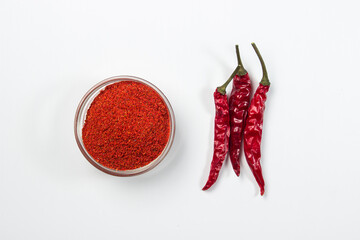 Sticker - Dried chili peppers and ground pepper on a white background. hot seasoning