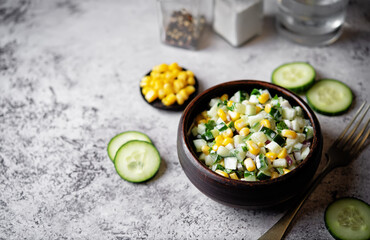 Wall Mural - Cucumber corn salad in a bowl