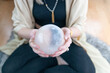 woman holding a crystal ball