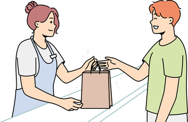 Smiling female seller give bag to male customer