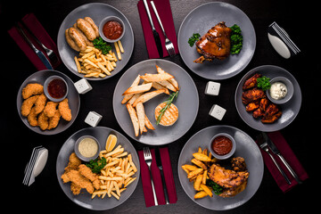 Poster - Combo snacks composition with chicken wings, lamb ribs, sausages, fried shrimp, onion rings, nuggets fish and french fries