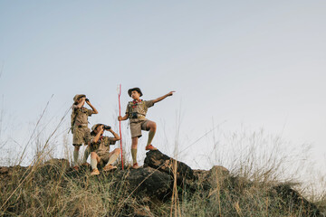 Boy scouts working on mountains nature adventures and travel