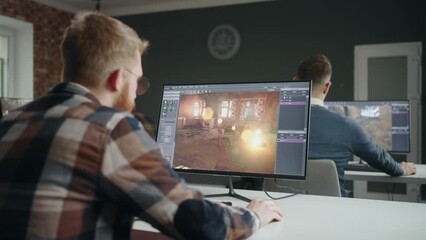 professional programmers creating new video games in office, group of game designers working