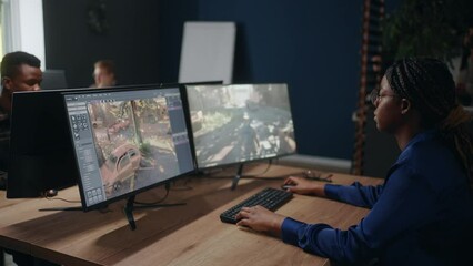inside office of video games development company, multiracial people working at computers