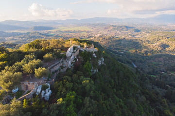 Wall Mural - View of Kaiser's Throne observation deck lookout, Pelekas village, Corfu island, Greece, Kaiser William II summit Observatory panoramic summer view with mountains and Kerkyra in the background