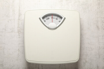 Canvas Print - Weigh scales on white textured background, top view. Overweight concept