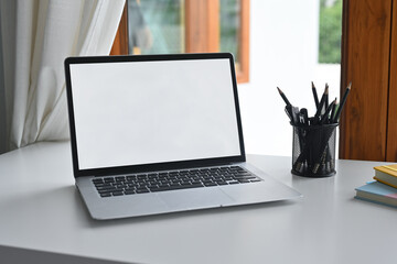 Poster - Empty screen of laptop place on office desk.