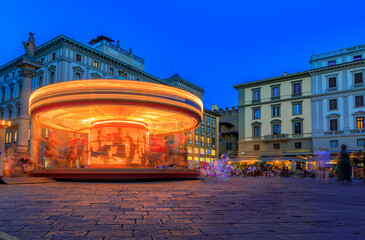 Wall Mural - Illuminated antique carousel on Piazza della Republica, Florence Italy at sunset