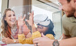 © Jade Maas/peopleimages.com - VR, education and family learning with a screen, metaverse studying and 3d homework. Creative, innovation and interracial mother, father and child helping with technology for knowledge together