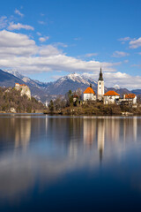 Canvas Print - Bled lake with Bled catle, church and winter Julian Alps at background