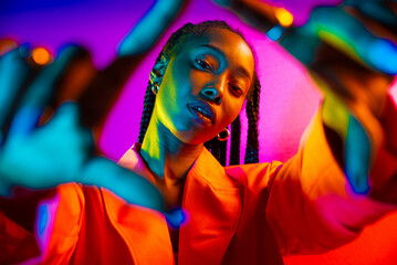 beautiful african american woman with afro pigtails hairstyle and stylish clothes - portrait of youn