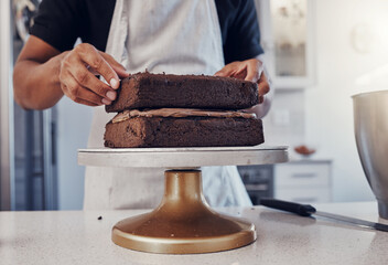 Wall Mural - Layering, preparation and hands of a man with a cake for a birthday, dessert and sweet treat. Kitchen, working and chef in a bakery baking food, confectionery and unhealhy snack on a counter