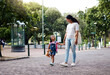 © Nina/peopleimages.com - Park, walking and mom holding hands with girl enjoy weekend, summer holiday and adventure outdoors. Love, black family and mother with child in morning for back to school, kindergarten and education