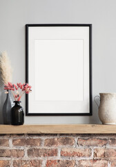 blank picture frame mockup on gray wall. modern living room design. view of modern loft style interi