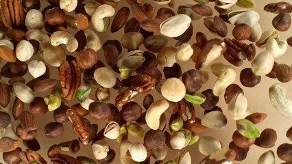 Poster - Super slow motion of rotating mix nuts up to the air. Filmed on high speed cinema camera, 1000fps, placed on high speed cine bot.