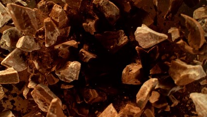 Poster - Super slow motion of rotating group of raw chocolate pieces. Super fast camera motion. Filmed on high speed cinema camera, 1000fps, placed on high speed cine bot.