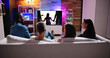 © Andrey Popov - Couples Watching TV At Night