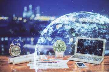 Poster - Computer on desktop with social network hologram. Double exposure. Concept of international people connections.