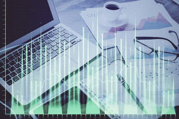 Poster - Stock market graph on background with desk and personal computer. Multi exposure. Concept of financial analysis.