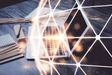 Poster - Computer on desktop with social network hologram. Double exposure. Concept of international people connections.